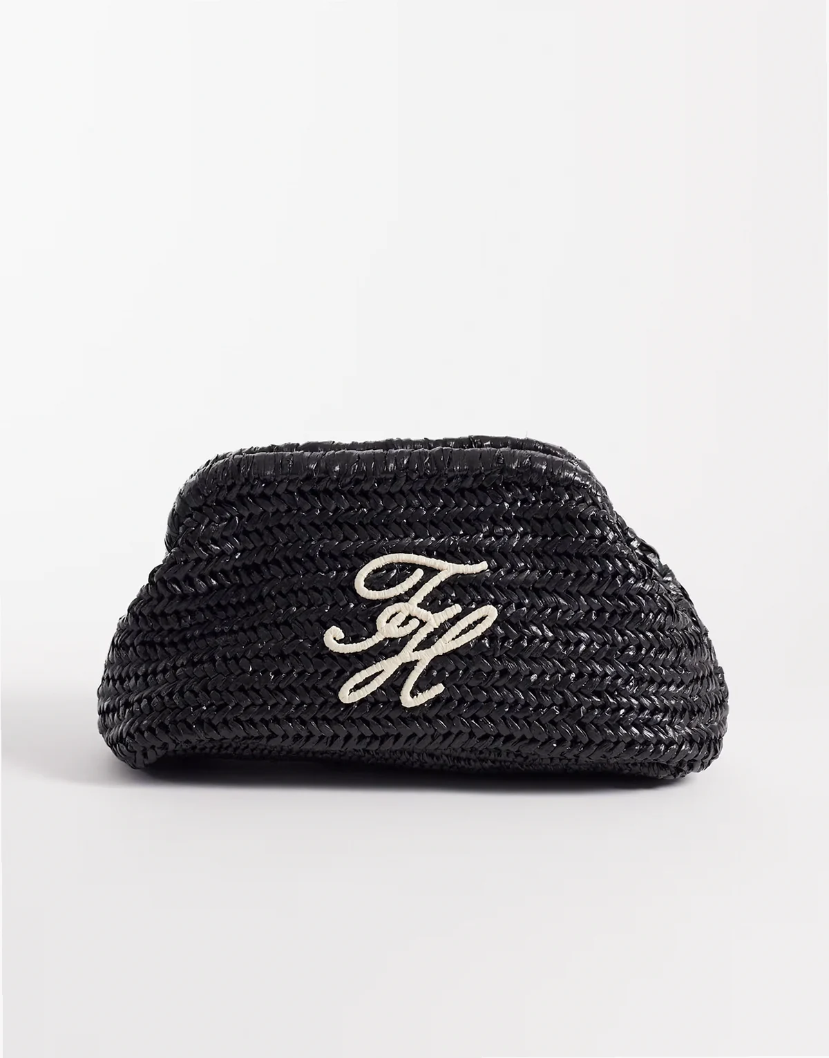 elevated raffia clutch bag in black