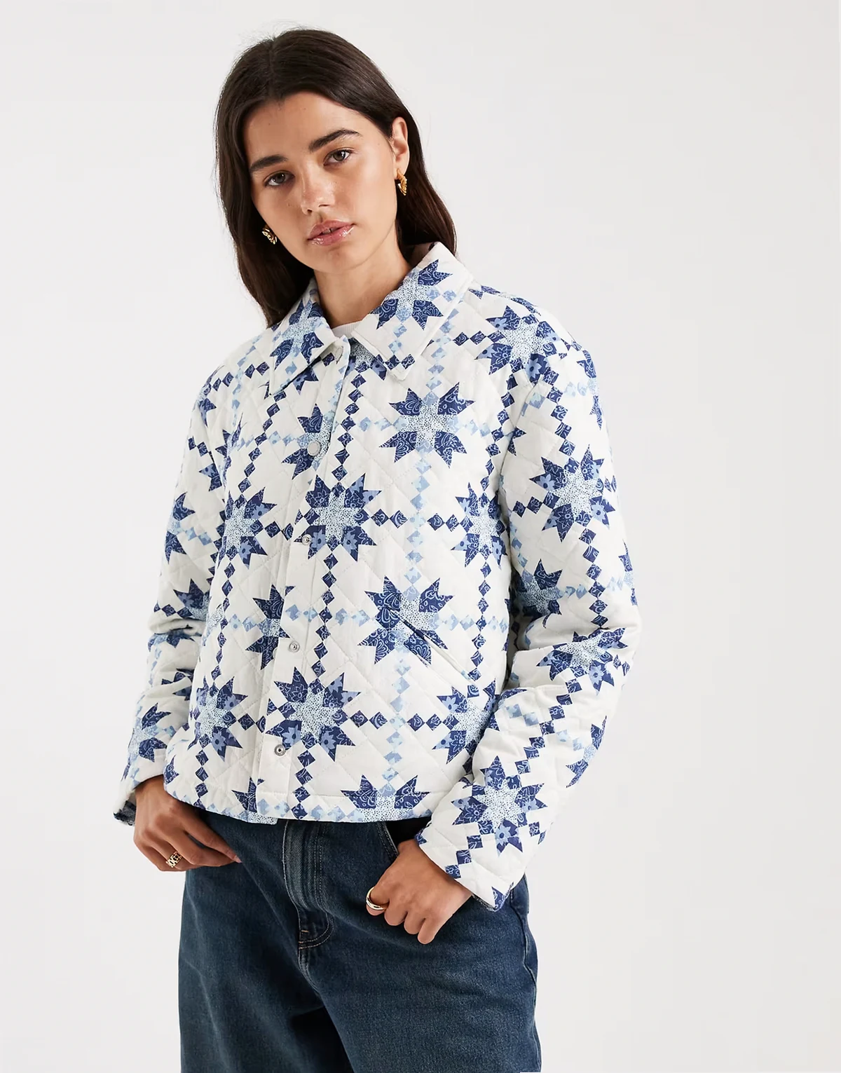 lightweight quilted jacket with blue paisley quilt pattern in white