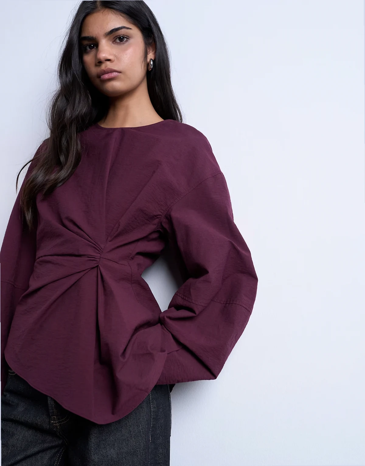 long sleeve pleat front top in burgundy