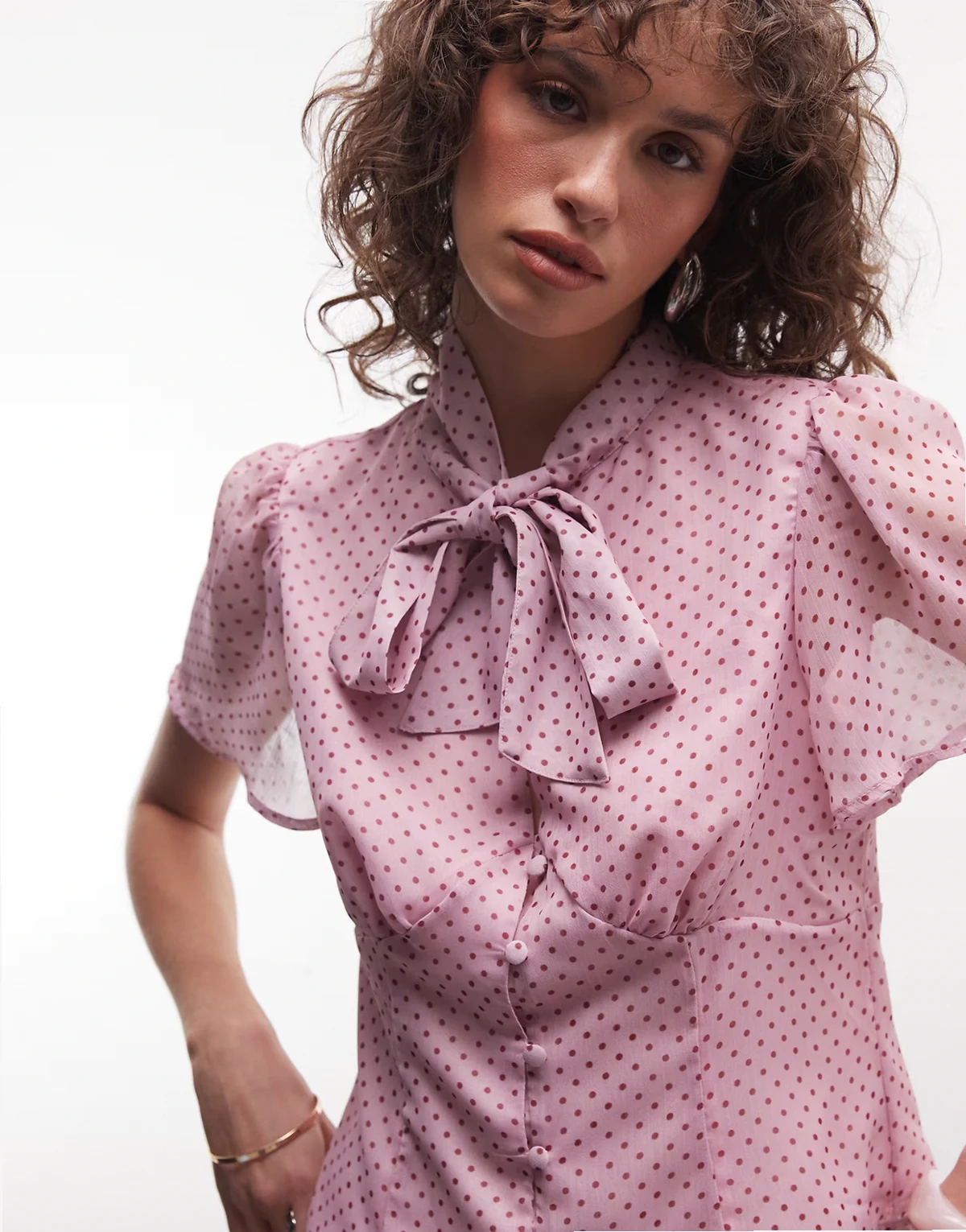 bow blouse with keyhole detail in pink and red polka dots