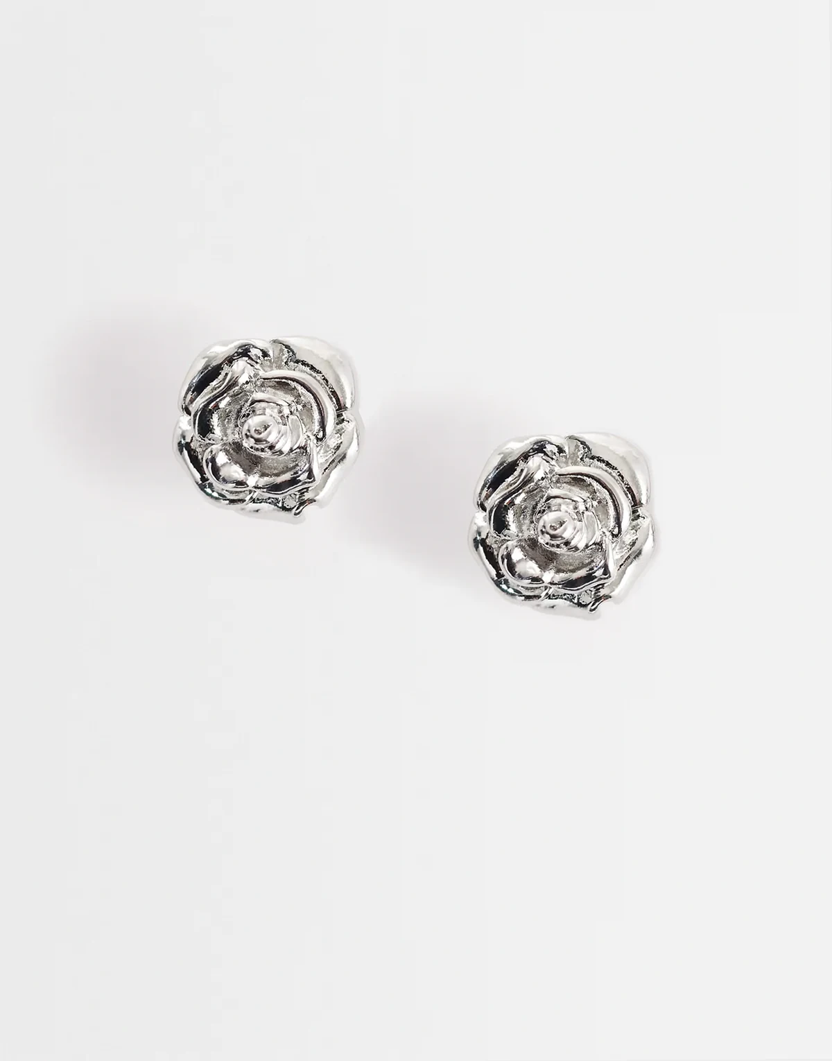 rose stud earrings in silver tone
