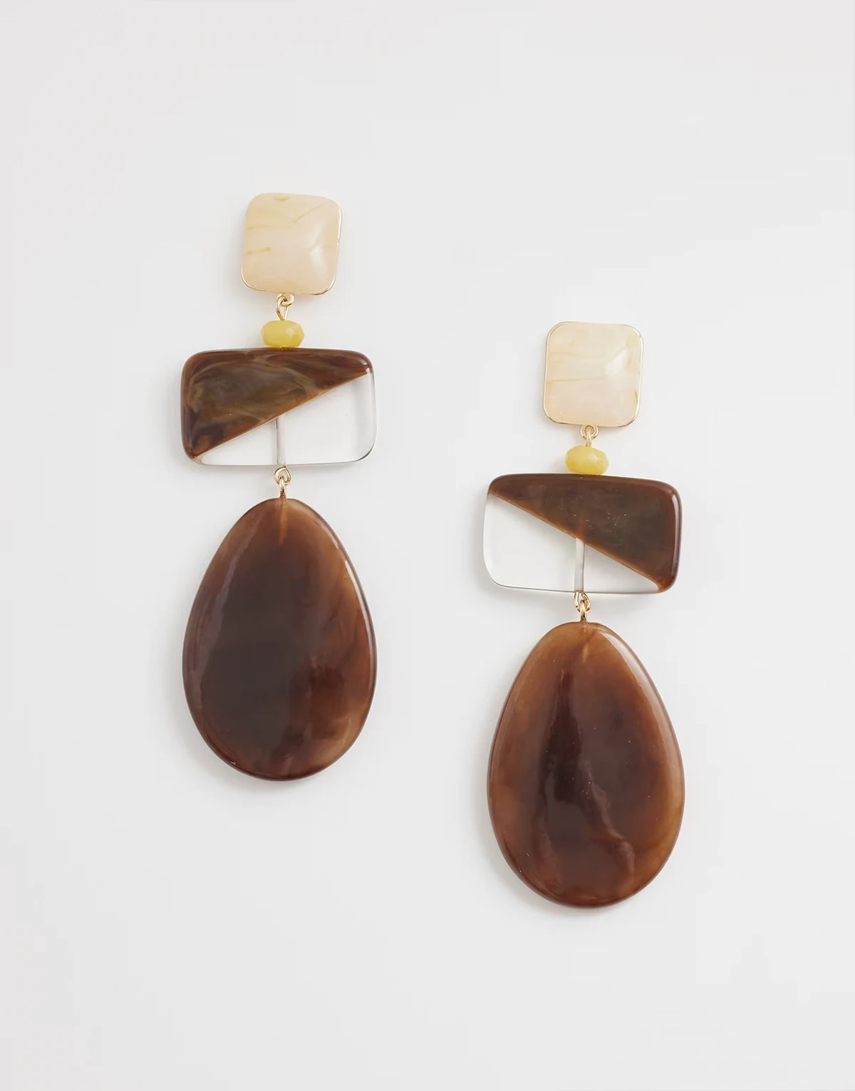 resin statement drop earrings in brown