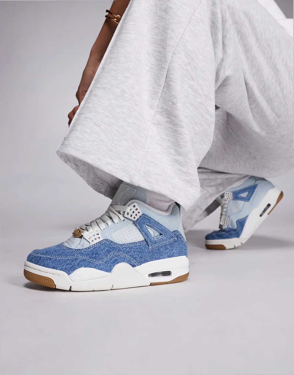 Nike Air Jordan 4 Retro sneakers in off white and brown
