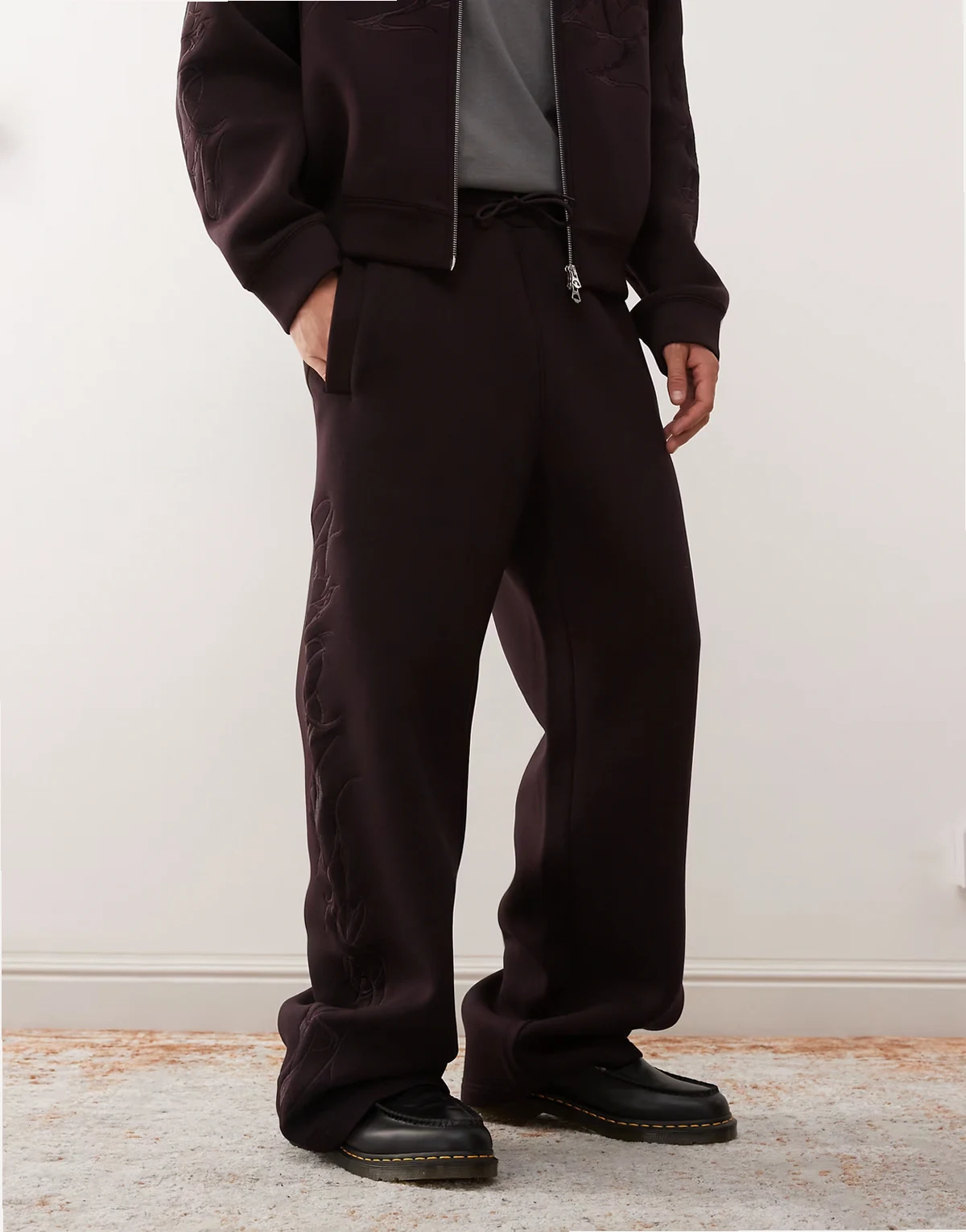 Simon sweatpants with embroidered graphic in burgundy scuba-style fabric - part of a set