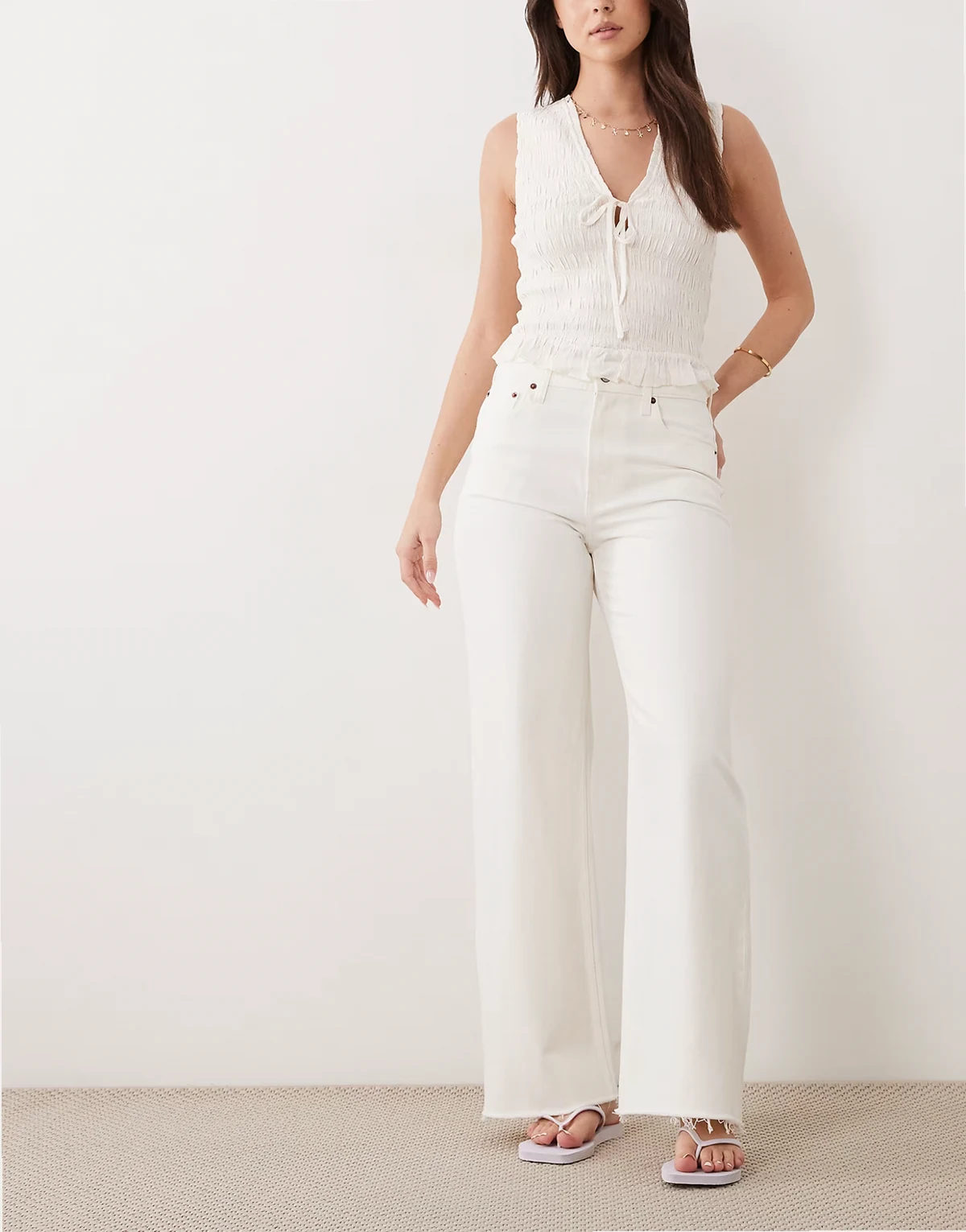 high rise wide leg jeans with frayed hem in white