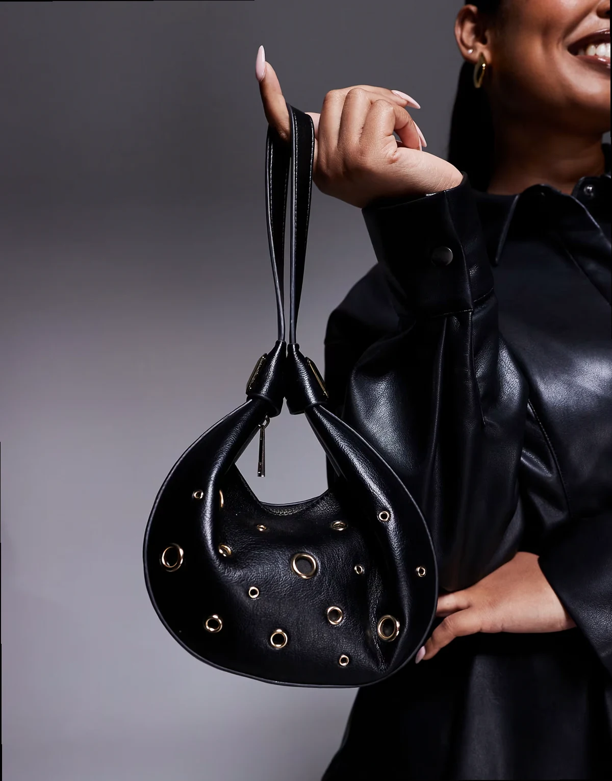 interchangeable shoulder and clutch bag with grommet studs in black