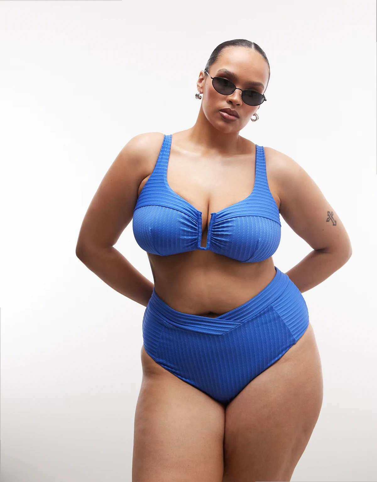 ASOS DESIGN Curve Rory spliced rib high waist wrap front bikini bottom in blue