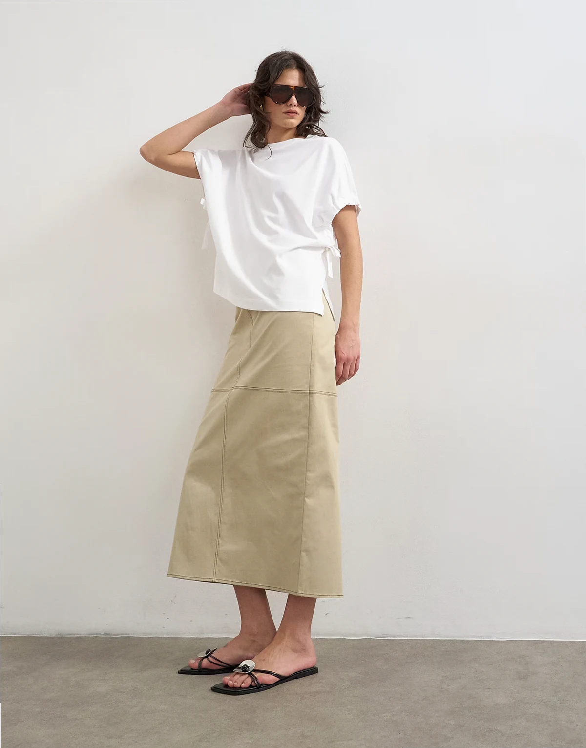 column midi skirt with contrast stitch detailing in stone