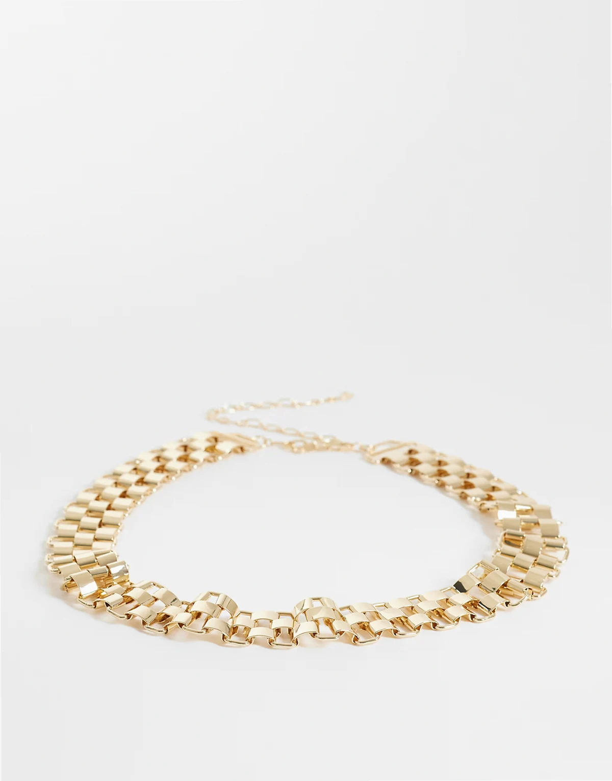 large watch-strap style belt in gold tone