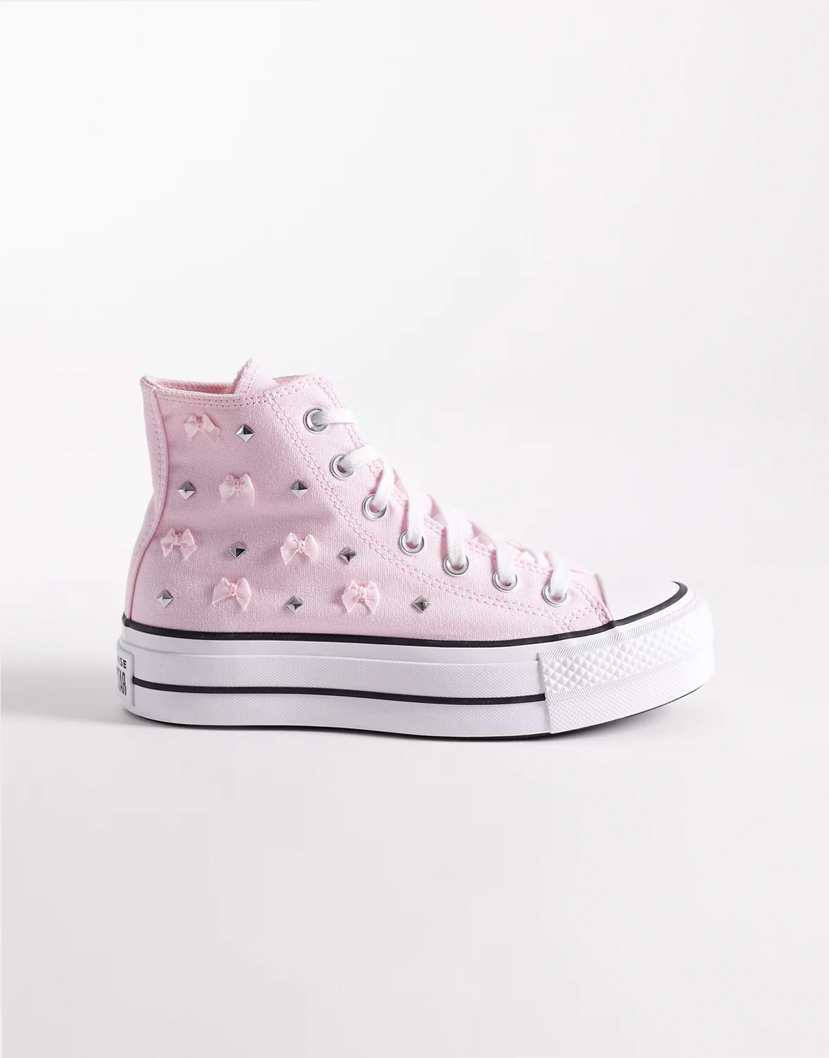 Chuck Taylor All Star Lift Hi platform sneakers with bow and stud detailing in pink