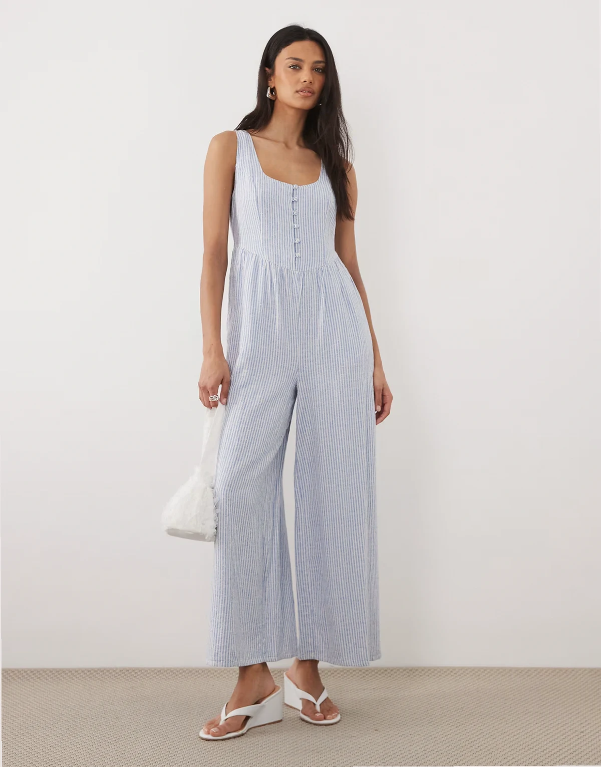 Cora pinstriped sleeveless jumpsuit in light blue