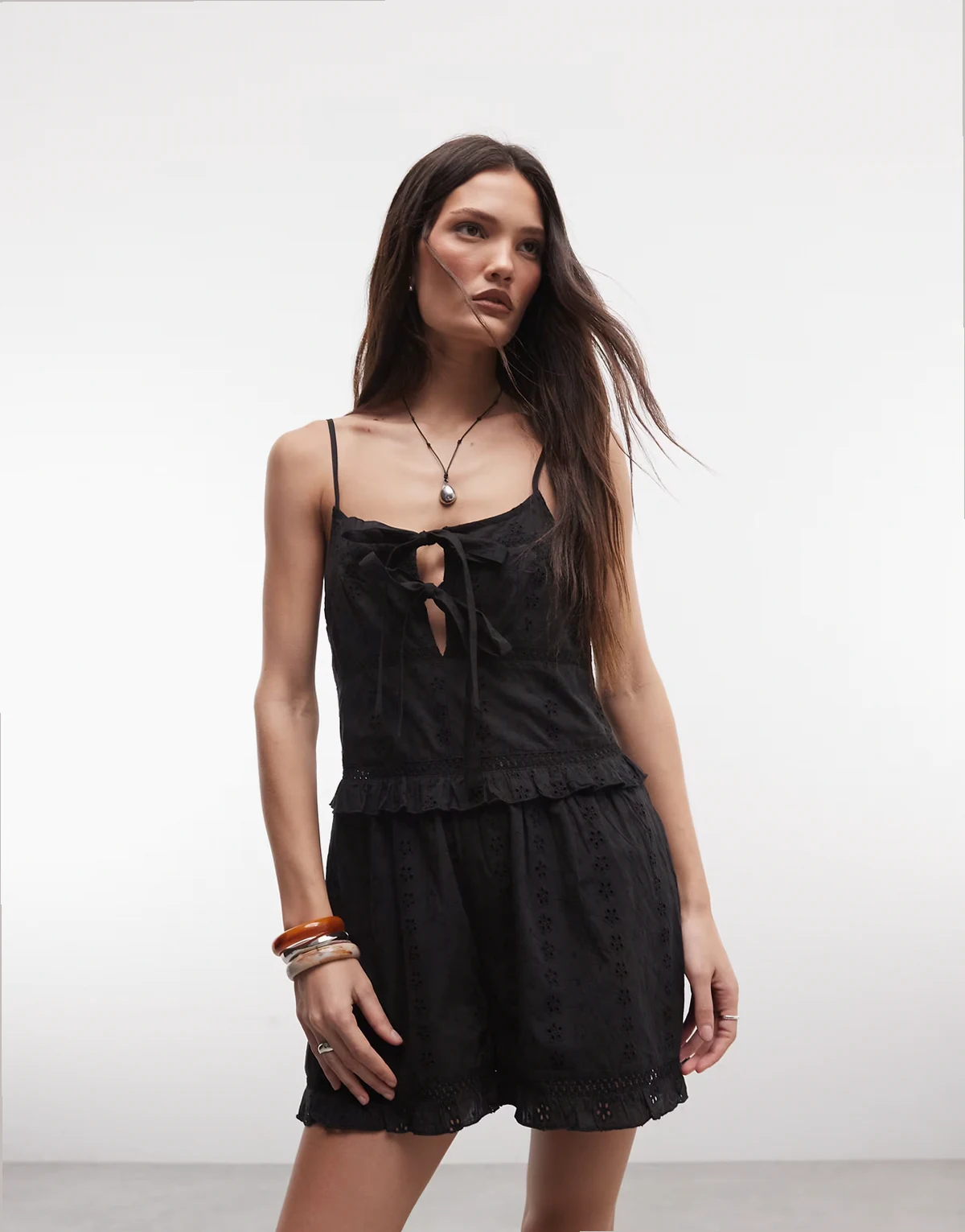 romper with bows in black eyelet