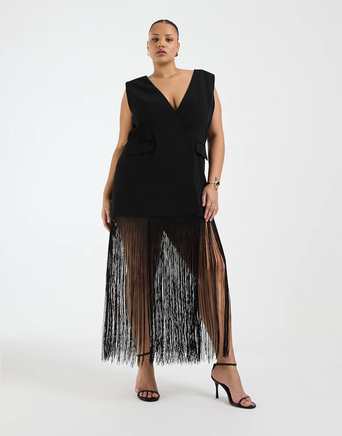 Curve sleeveless blazer with fringe hem in black